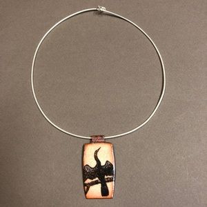 Artisan enamel bird pendant.